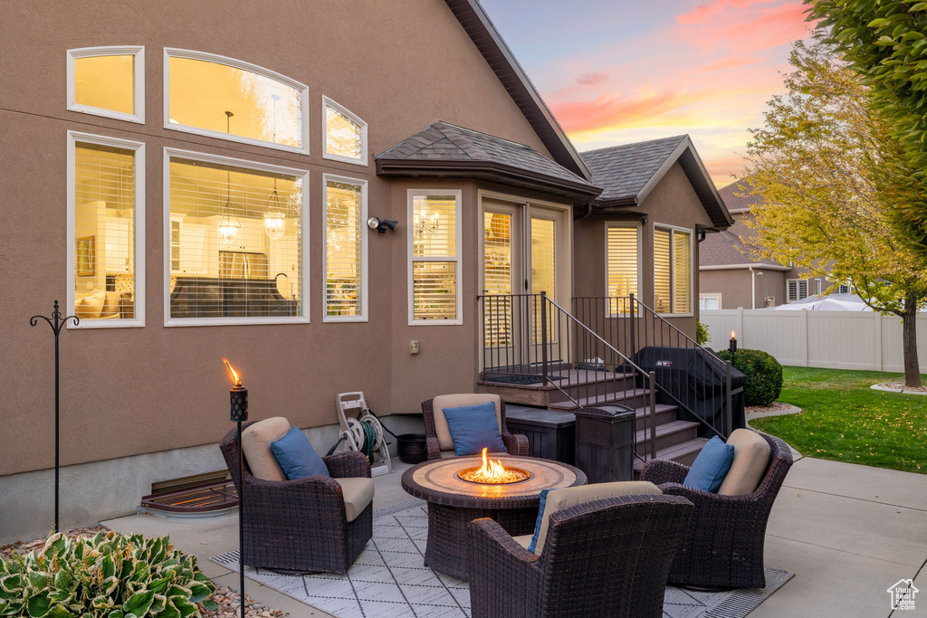 View of patio / terrace featuring fence and a fire pit