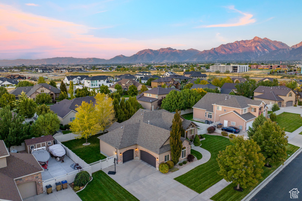 Aerial view at dusk with a residential view and a mountain view