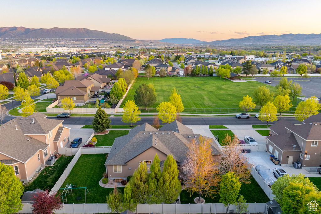 Aerial view at dusk featuring a residential view and a mountain view