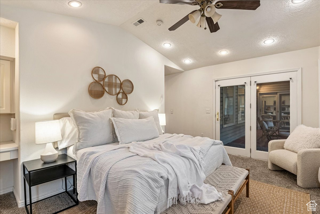 Carpeted bedroom with visible vents, access to exterior, recessed lighting, and lofted ceiling