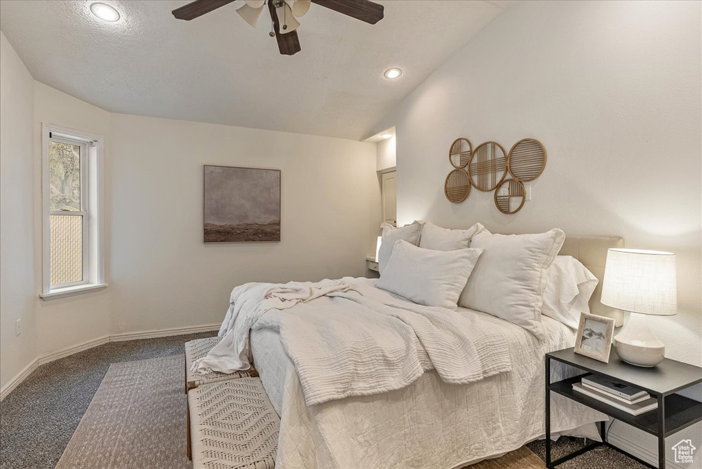 Carpeted bedroom with baseboards, a ceiling fan, lofted ceiling, and recessed lighting