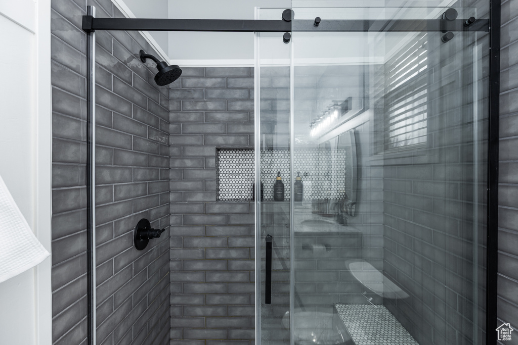 Full bathroom with a shower stall