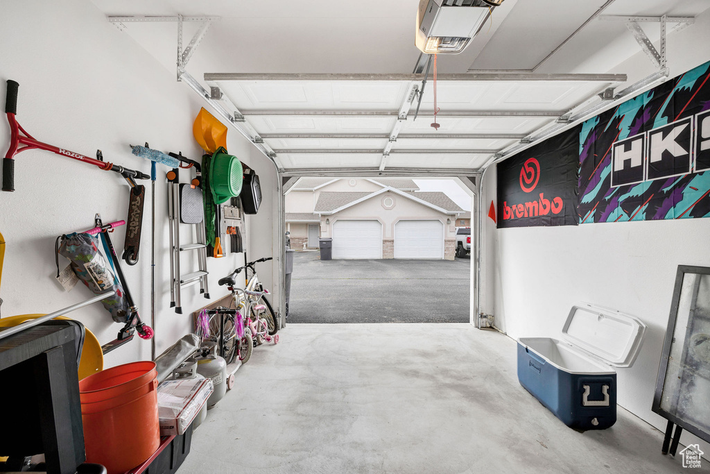 Garage featuring a garage door opener
