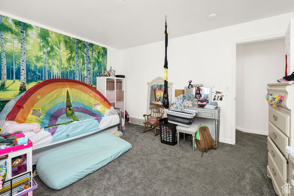 Bedroom with carpet floors and baseboards