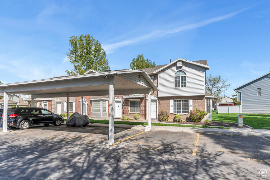 Exterior space featuring covered parking