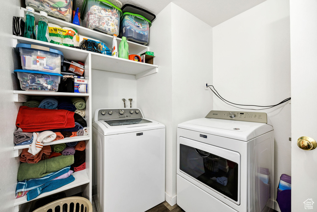 Clothes washing area featuring laundry area and independent washer and dryer
