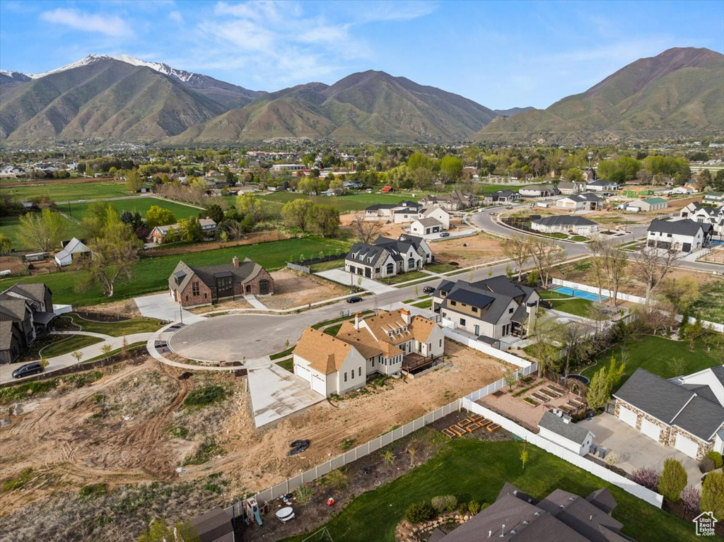 Drone / aerial view with a residential view and a mountain view