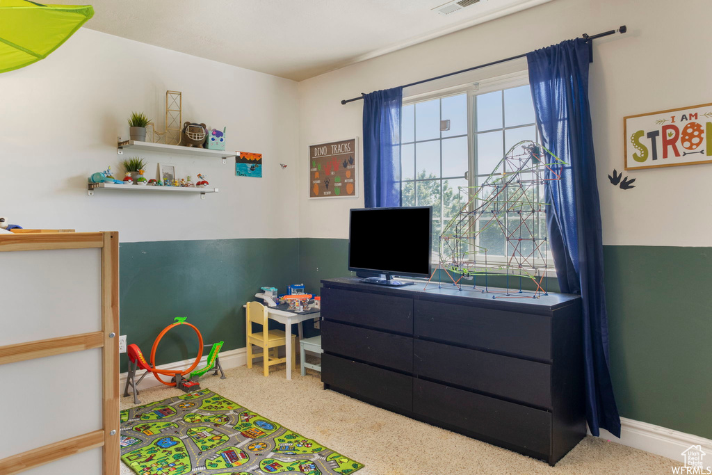 Bedroom featuring baseboards and visible vents