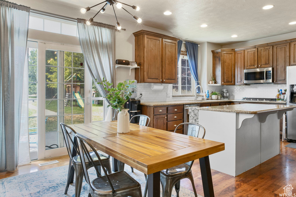 Kitchen featuring appliances with stainless steel finishes, plenty of natural light, and recessed lighting