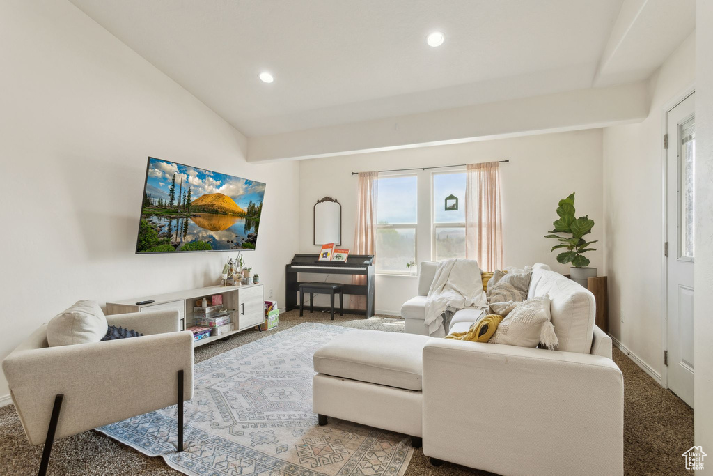 Carpeted living room with recessed lighting and baseboards