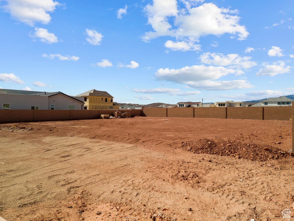 View of yard featuring fence
