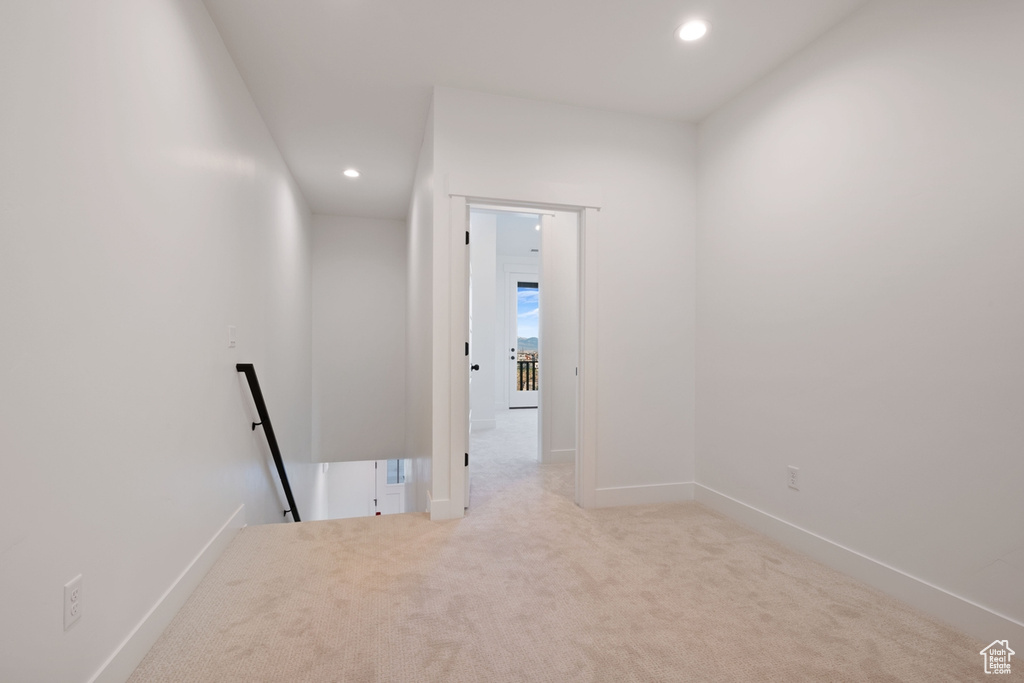 Corridor featuring baseboards, carpet flooring, recessed lighting, and an upstairs landing