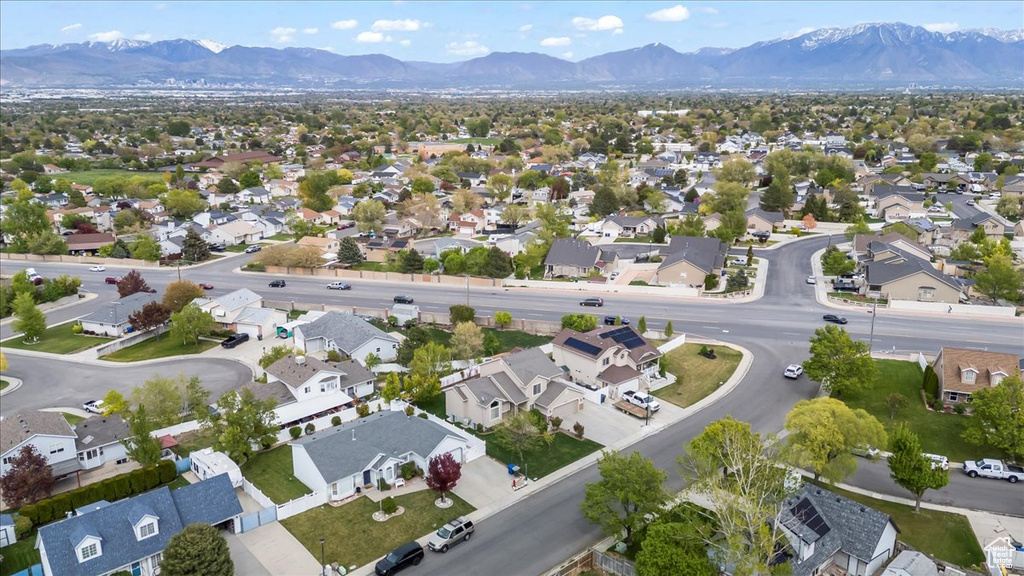Drone / aerial view with a residential view and a mountain view
