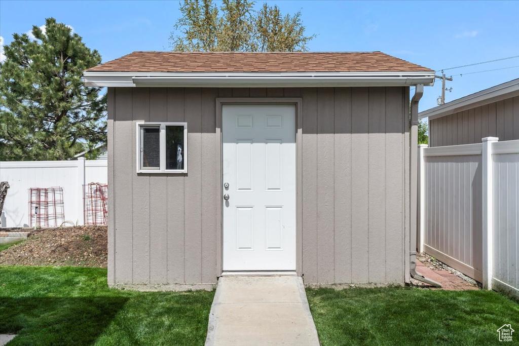 View of shed with fence