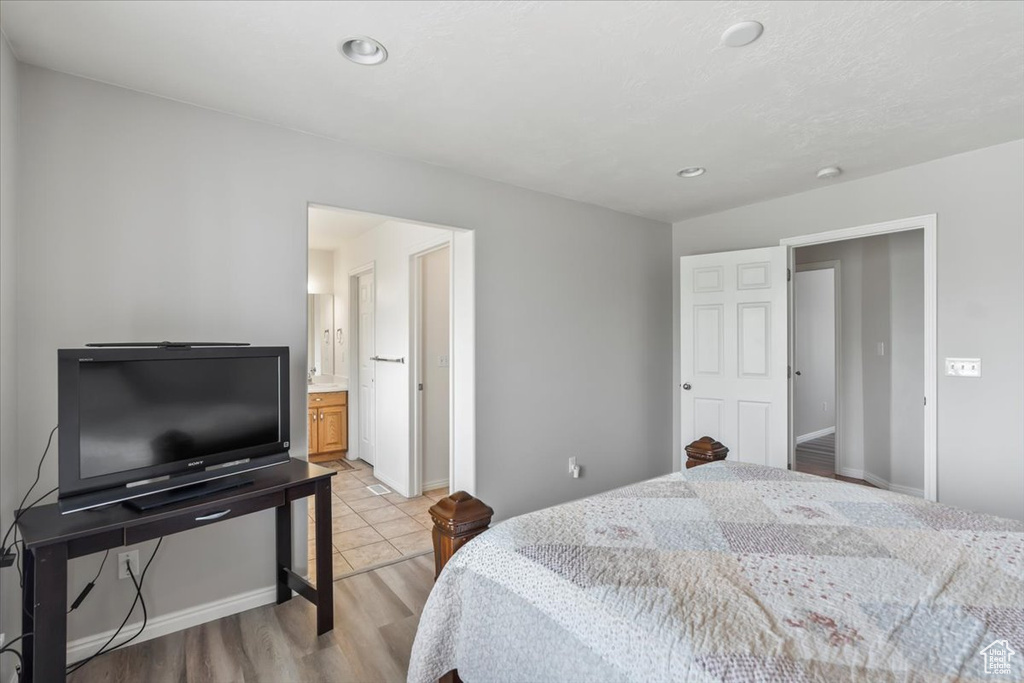 Bedroom featuring baseboards, recessed lighting, and light wood finished floors