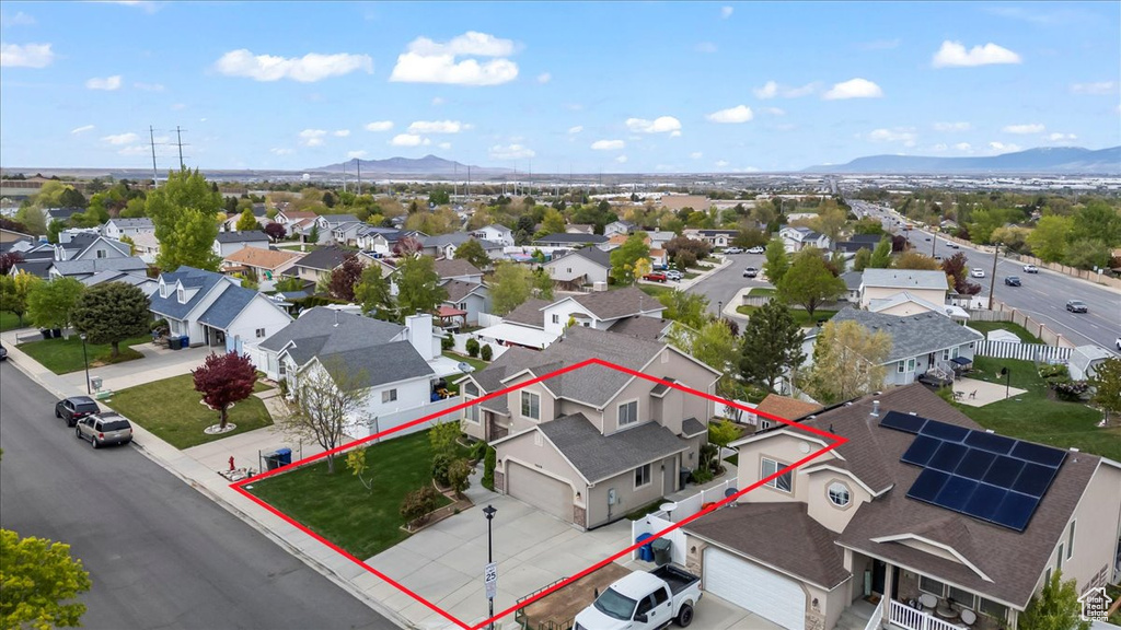 Birds eye view of property with a residential view and a mountain view