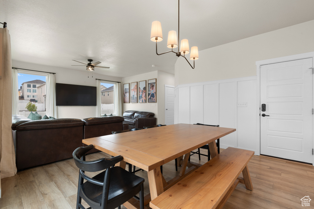Dining room featuring light wood-style flooring and ceiling fan