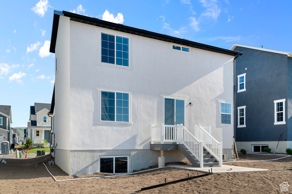 Back of house with stucco siding