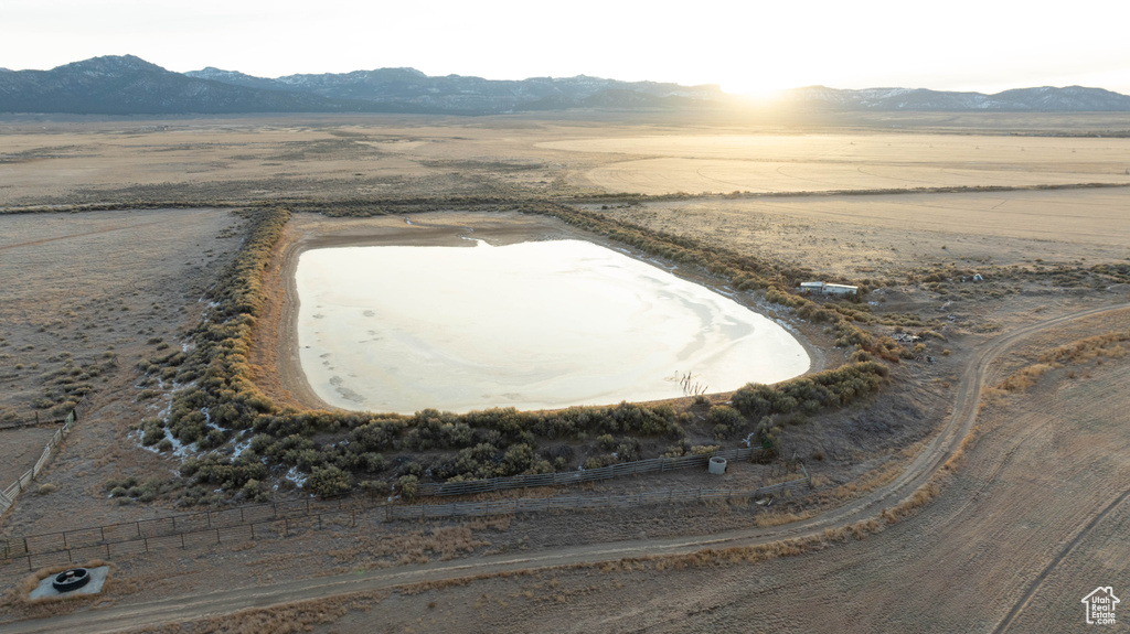 Aerial view featuring a rural view, a mountain view, and view of desert