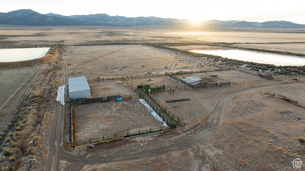 Drone / aerial view featuring a desert view, a mountain view, and a rural view