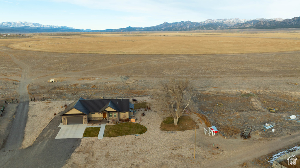 Birds eye view of property with a mountain view and a rural view