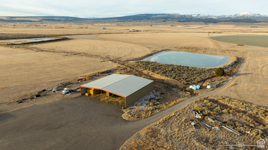 Aerial view featuring view of desert, a mountain view, and a rural view