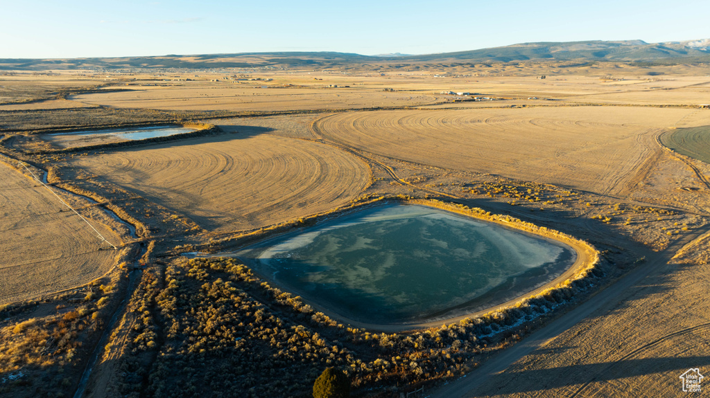 Birds eye view of property featuring a mountain view and a rural view