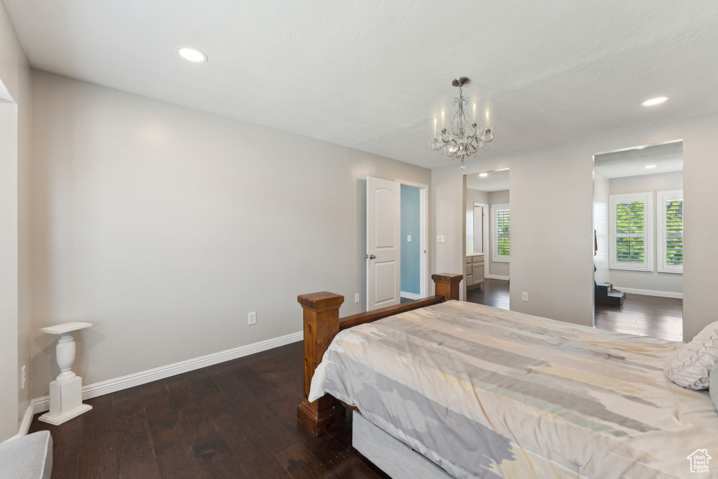 Bedroom with baseboards, recessed lighting, a chandelier, and hardwood / wood-style flooring