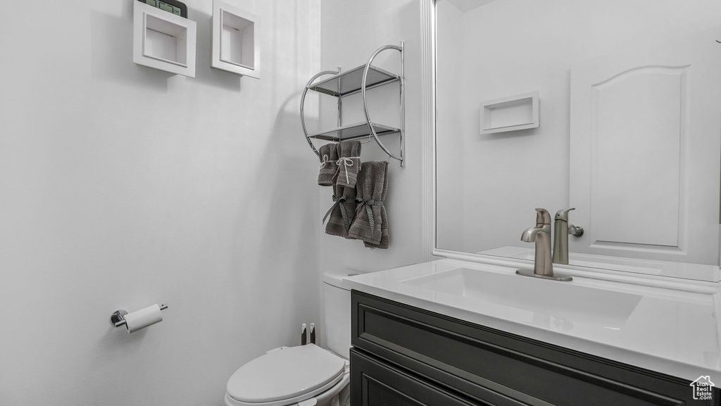 Bathroom with toilet and vanity