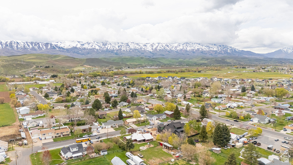 Birds eye view of property featuring a mountain view and a residential view