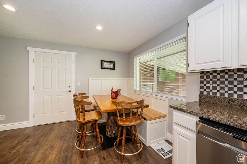 Dining area featuring recessed lighting, baseboards, visible vents, and dark wood-style floors