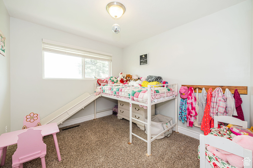 Carpeted bedroom with baseboards