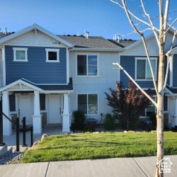 View of front of property with a front yard