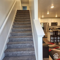 Staircase featuring recessed lighting