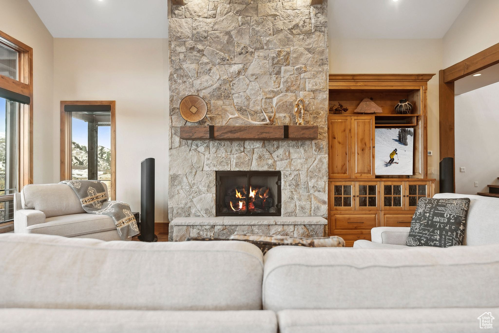 Living area featuring a stone fireplace