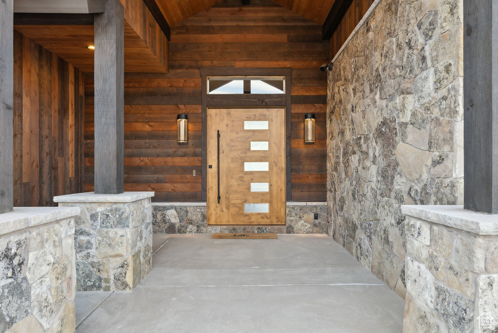 View of exterior entry with stone siding