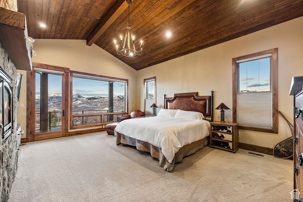 Bedroom featuring wood ceiling, a chandelier, carpet flooring, and baseboards