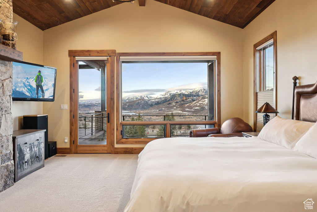 Carpeted bedroom with access to exterior, lofted ceiling, and wood ceiling