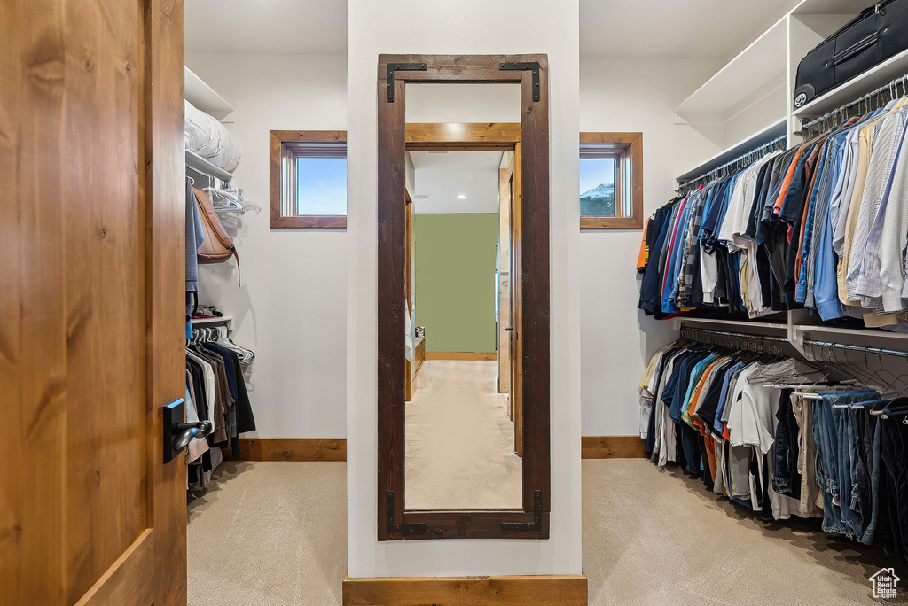 Spacious closet with carpet flooring