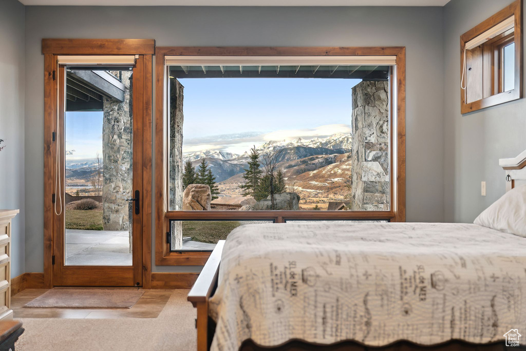 Bedroom with a mountain view and access to outside