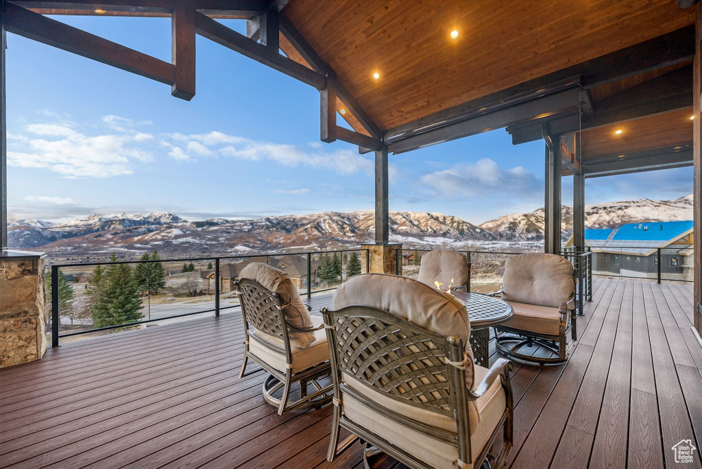 Wooden terrace featuring a mountain view
