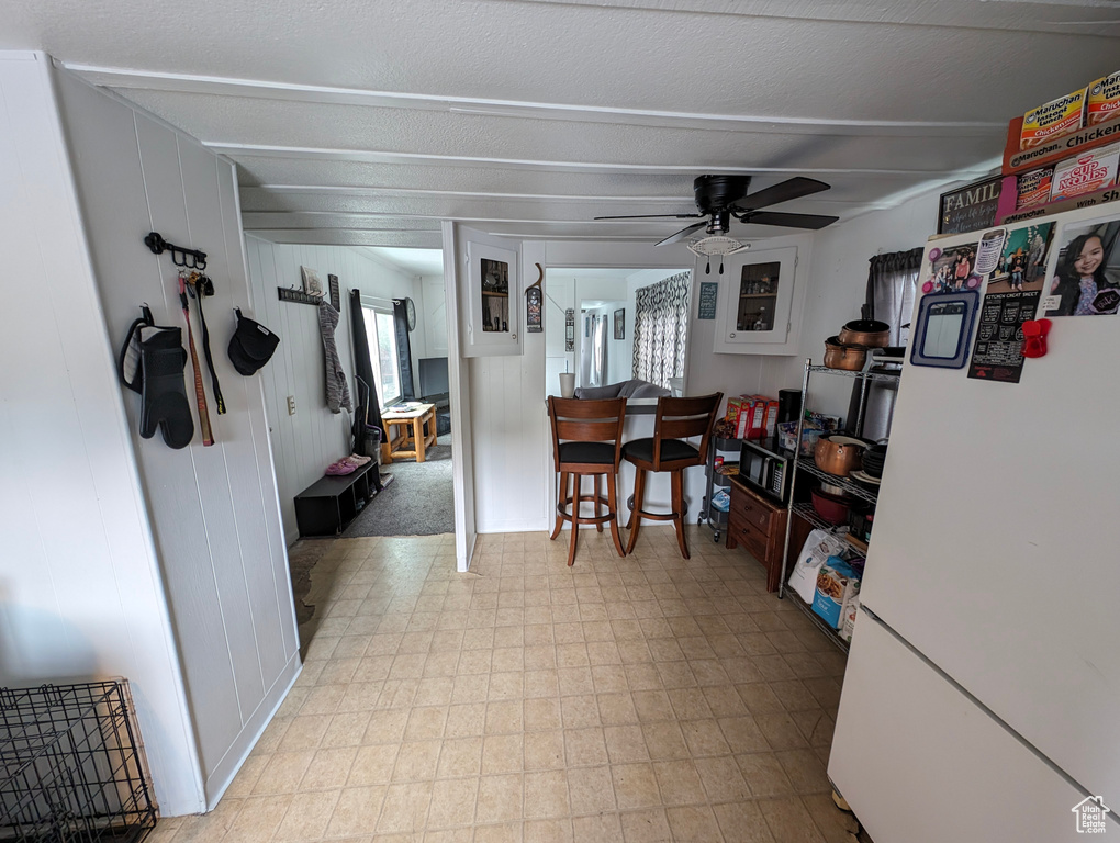 Dining space featuring ceiling fan and light floors