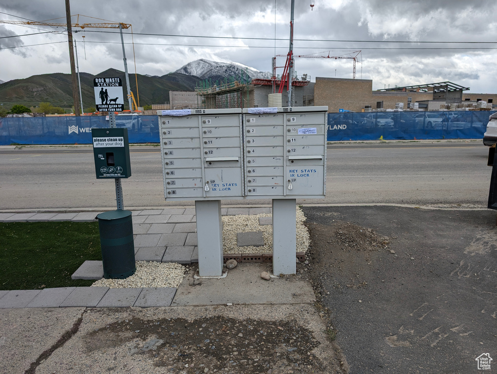 View of community with mail area and a mountain view