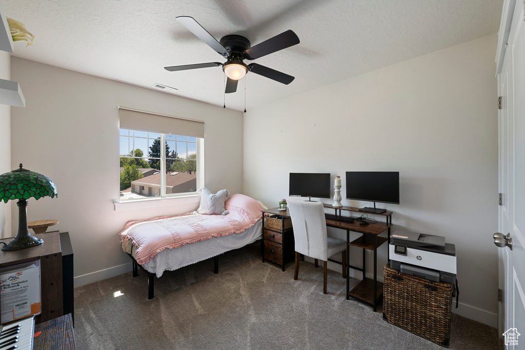 Bedroom with carpet flooring, a ceiling fan, baseboards, and visible vents