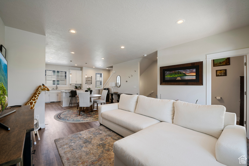 Living area featuring recessed lighting and wood finished floors