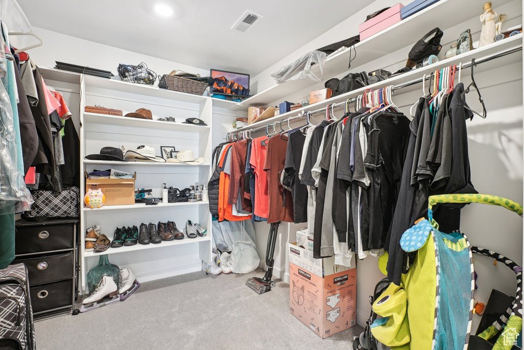 Walk in closet with carpet flooring and visible vents