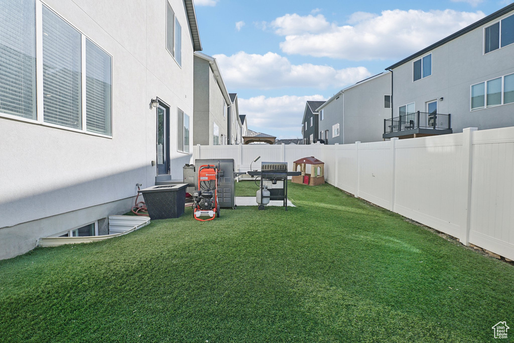 View of yard with a residential view and a fenced backyard