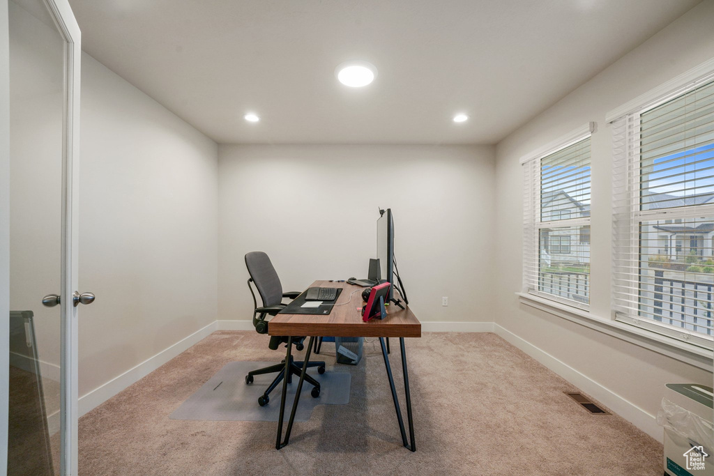 Carpeted home office featuring visible vents, recessed lighting, and baseboards