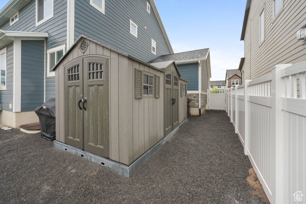 View of shed with a fenced backyard