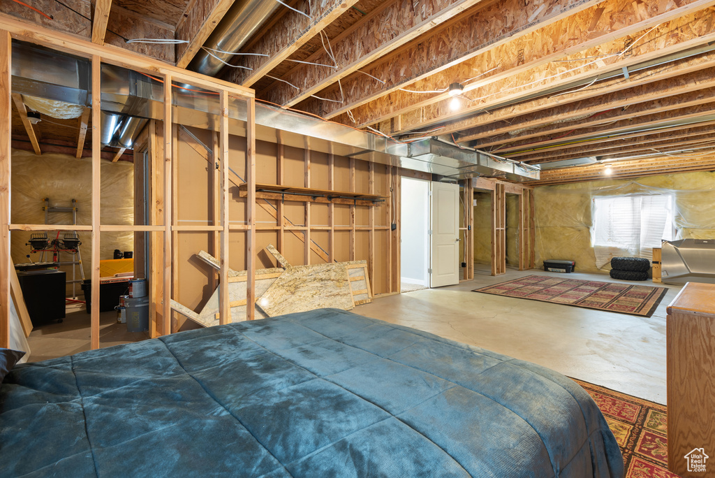 Bedroom featuring concrete flooring